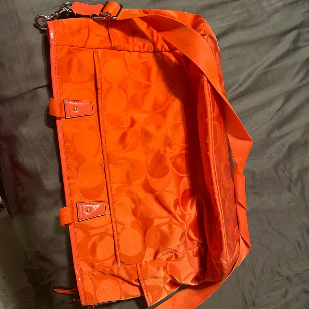 Orange coach diaper bag